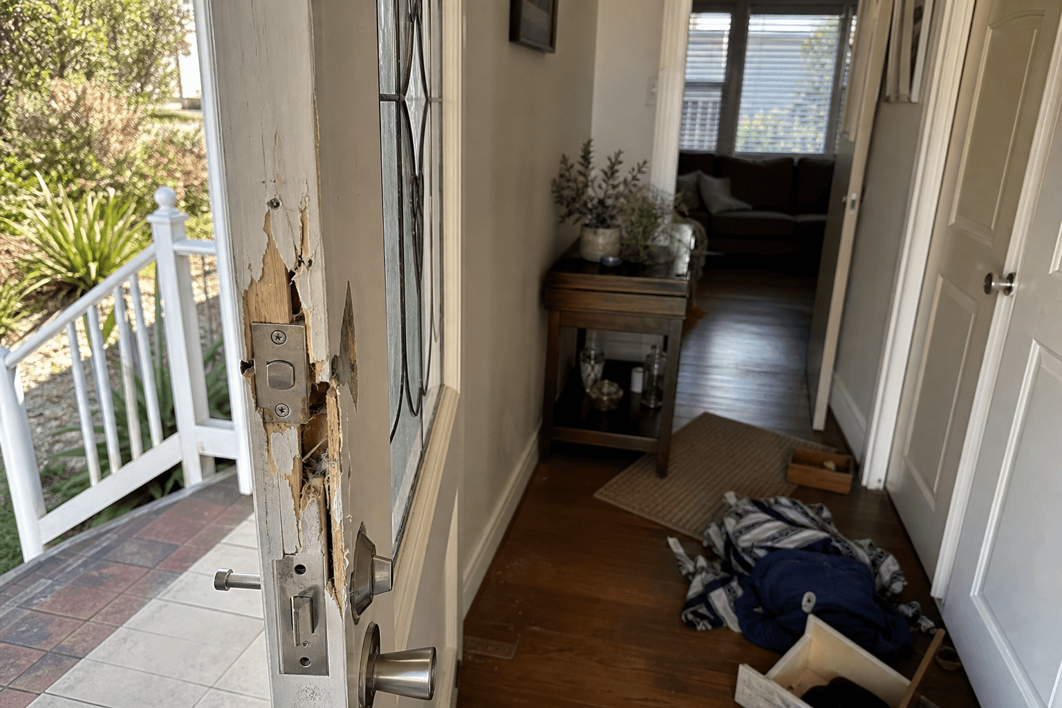 Damaged front-door frame after a residential break-in